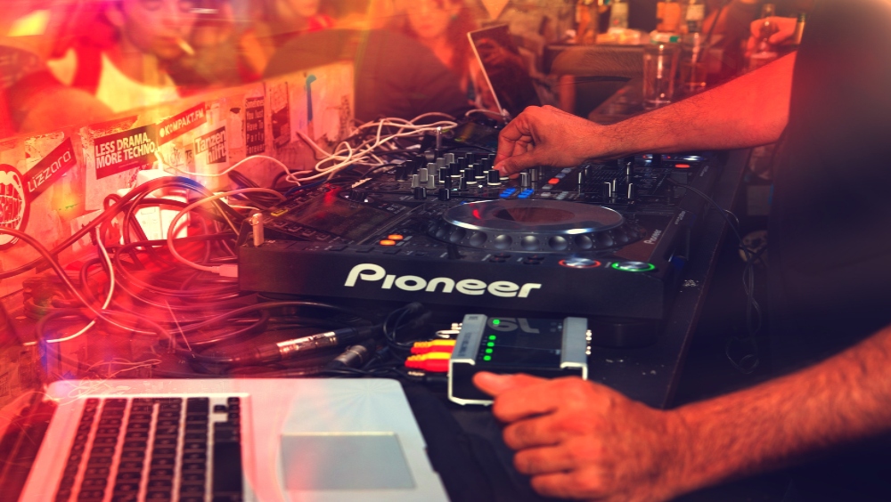 DJ playing decks
